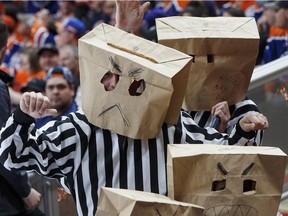 Fans mock the refs during the Anaheim Ducks and Edmonton Oilers game during the first period in game six of a second-round NHL hockey Stanley Cup playoff series in Edmonton on Sunday, May 7, 2017.