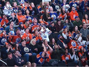 Fans react to a missed goal opportunity by the Oilers who are in San Jose taking on the Sharks, during game 4 on the score board screen at Rogers Place during the Oilers Orange Crush Road Game Watch Party in Edmonton, April 18, 2017.