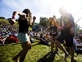 People dance to the Lost Bayou Ramblers during the Edmonton Folk Music Festival in Gallagher Park in Edmonton, Alta., on Sunday, Aug. 10, 2014. File photo.