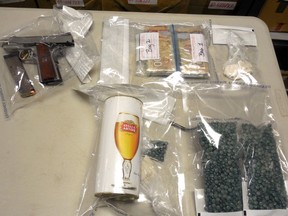 A handgun, cash and drugs were found in a bust by RCMP in Countryside South Nov. 23, 2016. Supplied