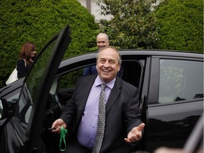 B.C. NDP leader John Horgan leaves with B.C. Green party leader Andrew Weaver from Government House after dropping of a signed document by 44 MLAs showing theres an agreement between the two parties in Victoria, B.C., on Wednesday, May 31, 2017.