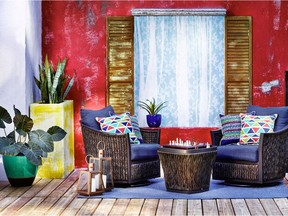 Cuban Cool, one of four outdoor furniture lines from Lowe's for 2017, uses green ceramic pineapples, metal copper stools, and red and blue resin planters to create a tropical feel.