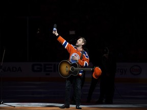 Brett Kissel reacts as fans at Rogers Place sing Star-Spangled Banner, prior to the Edmonton Oilers and Anaheim Ducks, in Edmonton Saturday April 30, 2017. Kissel's microphone did not work and the fans filled in.