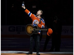 Brett Kissel reacts as fans at Rogers Place sing Star-Spangled Banner, prior to the Edmonton Oilers and Anaheim Ducks, in Edmonton Saturday April 30, 2017. Kissel's microphone did not work and the fans filled in. Photo by David Bloom