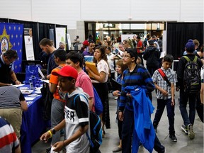 People make their way through Hall E during YOUth POWER's seventh annual career event at the Edmonton Expo Centre in Edmonton on Tuesday, May 30, 2017.