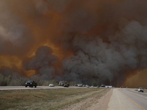 Residents of Fort McMurray flee southbound on Highway 63 on May 3, 2016. Wildfires forced the evacuation of the city as high temperatures and winds battered the region.