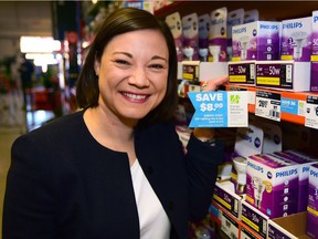 MLA Shannon Phillips, minister responsible for the Climate Change Office checks out some of the eligible products under the provincial government's Energy Efficiency Alberta's Residential Retail Products program at Home Depot on MacLeod Trail in Calgary, Alta., on April 29, 2017.