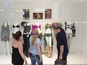 A collection of Britney Spears costumes, owned by store owner Dana Proctor, is on display at Surfco at West Edmonton Mall. The costumes are up for auction, and Proctor hopes to get $1 million for the collection.