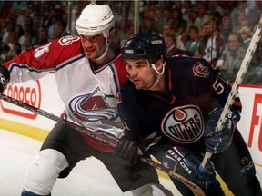 Colorado Avalanche centre Stephane Yelle, left, and Edmonton Oilers winger Andrei Kovalenko go shoulder-to-shoulder during Game 2 of their Western Conference semifinal series on May 4, 1997, in Denver.