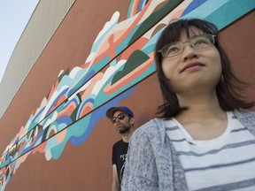 A new mural on the side of the Varscona theatre is part of Nextfest. Designed by West Coast artist Luke Ramsey (background), it was co-produced with Edmonton emerging artist Wei Li.