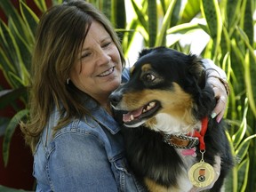 Tracy Matkea with her dog Becky Jo, a female Australian shepherd and border collie cross, who saved Tracy's life after she was thrown off a horse. The dog is being inducted into the Purina Animal Hall of Fame.