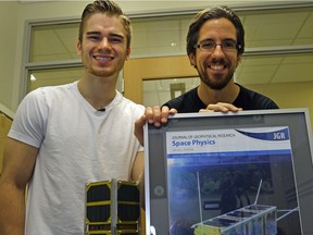 Tyler Hrynyk (left) and Dustin Nault  are University of Alberta Mechanical Engineering students who are working on a satellite project.