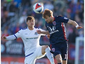 FC Edmonton midfielder Dustin Corea, left, and Indy Eleven defender Daniel Keller challenge for the ball in North American Soccer League play on Saturday, May 6, 2017 in Indianapolis, Indiana. The game ended in a 0-0 tie.