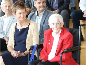 Sharon Trenaman, left, and Betty Carveth-Dunn take part in the induction ceremony at the Alberta Sports Hall of Fame in Red Deer on Friday, May 27, 2017.