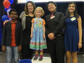 An entertaining crew of youngsters, aided by Edmonton Public School Foundation director Tracy Poulin, second from left, made a pitch to fund a new kindergarten in the Terwillegar community Friday before a crowd of 500 at the Lillian Osborne High School. Speakers were Sudharshan Palaniyappan, 11, left, Sophie Chute, 6, and emcees Michael Zhang, 16, and Neha Vashist, 18.