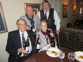 Roger and Marie Goulet (front row) shared the 20th anniversary dinner of their Les Chevaliers des Vins de France last week with co-founders Marc Vigneron (back row left) and Dr. Bernard Lee.