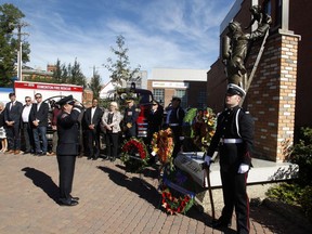 Wreaths are laid in the Edmonton Firefighters Memorial Plaza in Old Strathcona during an annual event held every Sept. 11, recognizing Edmonton firefighters who gave their lives in the line of duty.