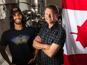 PhD student Roshan Achal and his supervisor Robert Wolkow at a lab at the University of Alberta in June 2017. The two were involved in creating the world's smallest maple leaf in honour of Canada 150.