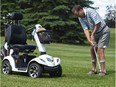 Allen Henschel, who has MS still plays golf and has a scooter which he uses to transport him around the course  in Edmonton, June 23, 2017.