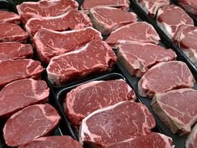 In this Jan. 18, 2010 file photo, steaks and other beef products are displayed for sale at a grocery store in McLean, Va. Ranchers are suing the U.S. Department of Agriculture, seeking a return of labels that clearly identify meat produced in other countries and imported to the United States. The Department of Agriculture on Monday, June 19, 2017, declined to comment on a matter that is in litigation.