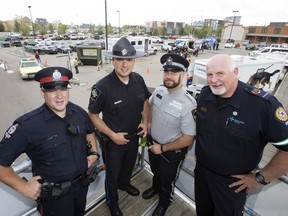 EPS Const. Tim Connell (from left), sheriff Geoff Campbell, peace officer Steve Schmidt and paramedic Mark Carson have begun a 53-hour camp out on the roof of the south Edmonton Cabela's store as a fundraiser for Special Olympics Alberta, in Edmonton on Friday, June 16, 2017.