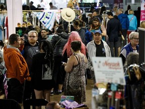 People make their way through corridors during Night Market Edmonton at the Alberta Aviation Museum in Edmonton on Friday, June 9, 2017.