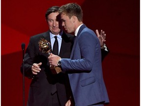 Connor McDavid of the Edmonton Oilers talks with Wayne Gretzky after McDavid wins the Hart Memorial Trophy (Most Valuable Player to His Team) during the 2017 NHL Awards and Expansion Draft at T-Mobile Arena on June 21, 2017 in Las Vegas, Nevada.