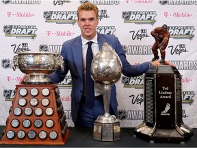 Connor McDavid of the Edmonton Oilers poses with the Art Ross Trophy, Hart Memorial Trophy and the Ted Lindsay Award after the 2017 NHL Awards and Expansion Draft at T-Mobile Arena on June 21, 2017 in Las Vegas.