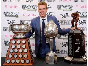 Connor McDavid of the Edmonton Oilers poses with the Art Ross Trophy, Hart Memorial Trophy and the Ted Lindsay Award after the 2017 NHL Awards and Expansion Draft at T-Mobile Arena on June 21, 2017 in Las Vegas, Nevada.