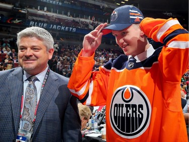 Edmonton Oilers head coach Todd McLellan, left, stands with Dmitri Samorukov after the NHL club selected the Russian winger selected 84th overall at the 2017 NHL Draft on June 24, 2017, in Chicago.