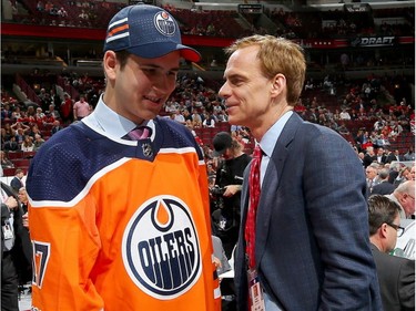 Kirill Maksimov meets with executive Scott Howson after being selected 146th overall by the Edmonton Oilers during the 2017 NHL Draft on June 24, 2017 in Chicago.