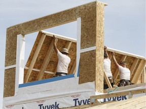 A crew works on a new house at 122 Street and 177 Avenue in the new Newcastle neighbourhood in northwest Edmonton.