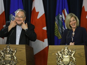 Alberta Premier Rachel Notley, right, reacts as government house leader Brian Mason hams it up during a news conference at the Alberta legislature in Edmonton on Tuesday, June 6, 2017, at the end of the spring session of the legislature.