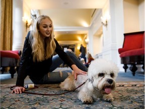 Aleta Stutheit hangs out with Lucy during Haute Dawg at the Fairmont Hotel Macdonald in Edmonton on Saturday, May 27, 2017.