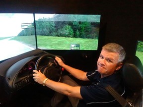 Ron Wilson, manager of driver education for the Alberta Motor Association, sits in the Roadbot driving simulator in Edmonton on June 29, 2017.