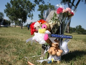 A memorial for Ashton Cardinal, 17, grows in a green space near Parkridge Estates at 29 Street and 116A Avenue in Edmonton on June 26, 2017. Cardinal was identified by family members as the 17-year-old boy found dead in the apartment complex's parking lot on June 23, 2017.