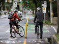 People using the new bikes lanes on 100 Ave. near 106 Avenue on Friday June 16, 2017, in Edmonton.