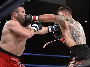 Adam Braidwood,  right, fights Tim Hague during the KO 79 boxing event at the Shaw Centre in Edmonton on Friday, June 16, 2017. He died two days later.