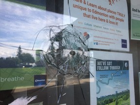 A bullet hole is seen in the window of the City of Edmonton Community Services office at 600A Hermitage Road on Thursday, June 1 2017. Edmonton Police Service homicide detectives were investigating the death of a man found lying on the ground at 40 Street and Heritage Road.