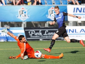 Edmonton's Dean Shiels can't get the ball past San Francisco's Romuald Peiser during FC Edmonton's NASL soccer game against the San Francisco Deltas at Clarke Stadium in Edmonton, Alta., on Saturday, June 24, 2017.