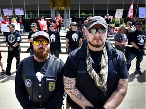Left, Beau and Greg, Leaders of the Three Percenters said they look to keep the event safe for those standing behind them. Anti-islamic immigration protesters and the Calgary Anti-Fascist Action protesters clashed, discussed, and shared their differing views outside of City Hall in Calgary, Alta., on June 3, 2017.