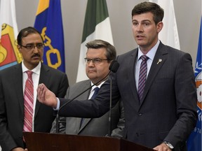 Edmonton Mayor Don Iveson, with Federal Infrastructure and Communities Minister Amarjeet Sohi, left, and Montreal Mayor Denis Coderre, urged the Trudeau government to help with costs related to the legalization of marijuana at the Federation of Canadian Municipalities conference in Ottawa on Friday, June 2, 2017.