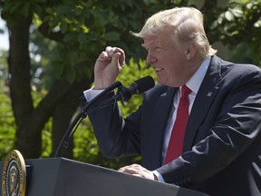 President Donald Trump announces that the U.S. will withdraw from the Paris climate change accord, Thursday, June 1, 2017, in the Rose Garden of the White House in Washington.