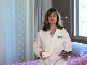 Dr. Jennifer Ringrose, a medical researcher and assistant professor of medicine at the University of Alberta displays a home blood pressure monitor. A research study led by Ringrose concluded that home blood pressure monitors are inaccurate 70 per cent of the time.