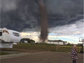 Dramatic photos of a tornado that touched down near the town of Three Hills in central Alberta just after 5 p.m. on Friday afternoon. Photos courtesy Dodi Brauen