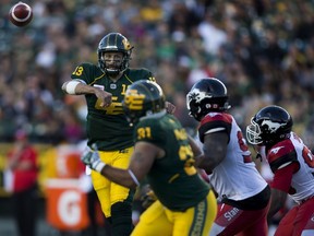 Edmonton Eskimos quarterback Mike Reilly (13) makes a pass to Devon Bailey (81) in overtime against the Calgary Stampeders on Saturday, September 10, 2016 in Edmonton. Greg  Southam / Postmedia  (To go with sports story) Photos for stories, columns off Eskimos game appearing in Sunday, Sept. 11 edition.