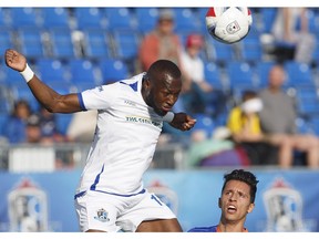 FC Edmonton Sainey Nyassi (14) heads the ball as Miami FC Roberto Baggio Kcira (14) defends during first half action at Clarke Park. June 10, 2017.