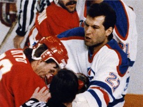 Dave Semenko punches Calgary Flames centre Joel Otto in the face during Game 1 of their playoff series on April 18, 1986.