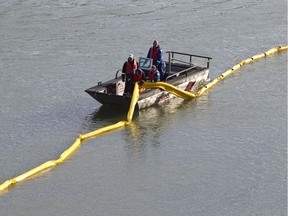 Crews work during a half-day oil spill training exercise held at Capilano Park along the North Saskatchewan River in Edmonton, Alberta on September 12, 2012. Workers with Enbridge Pipelines Inc., Pembina Pipeline Corporation as well as Edmonton Fire Rescue Service personnel participated. File photo.