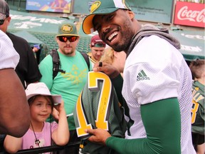 Eskimos wide receiver Shamawd Chambers signs autographs during Eskimos Fan Day at Commonwealth Stadium in Edmonton on Tuesday, July 4, 2017.